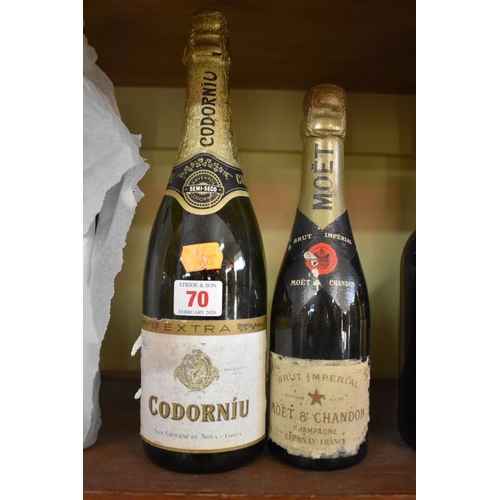 70 - An old half bottle of Moet & Chandon Brut Imperial champagne; together with a 75cl bottle of Cor... 