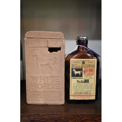 86 - A rare old half bottle of White Horse whisky, bottled 23 February 1956, in original carton.... 