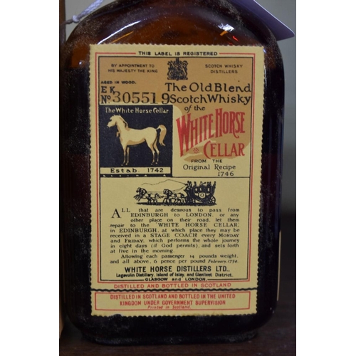 86 - A rare old half bottle of White Horse whisky, bottled 23 February 1956, in original carton.... 