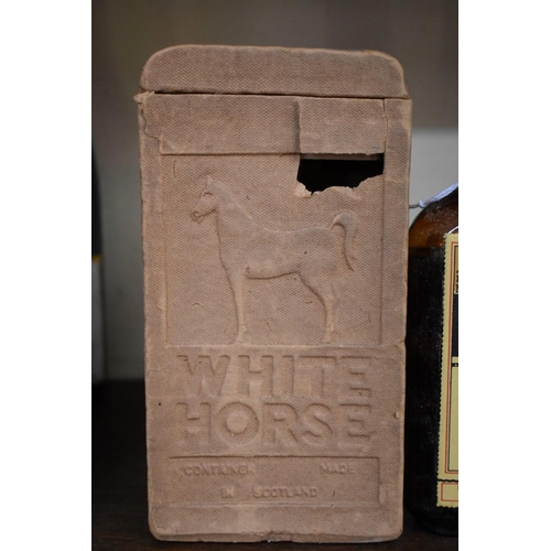 86 - A rare old half bottle of White Horse whisky, bottled 23 February 1956, in original carton.... 