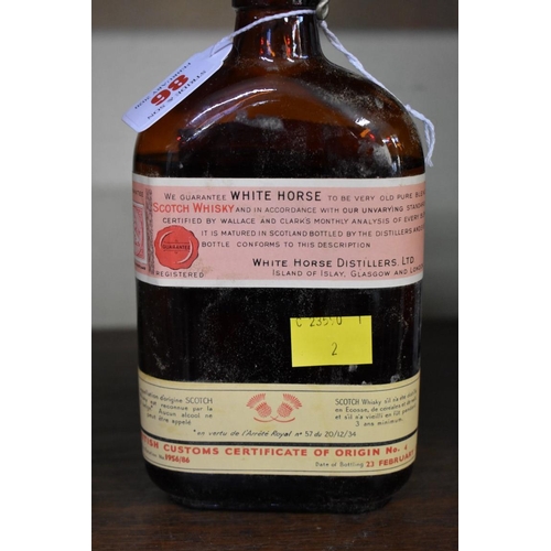 86 - A rare old half bottle of White Horse whisky, bottled 23 February 1956, in original carton.... 