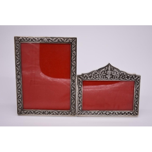 371 - Two Thai white metal photograph frames, aperture of largest 15 x 20cm. (2)