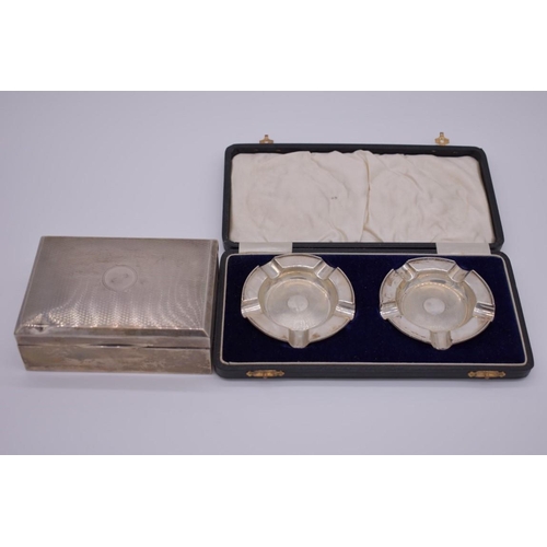 372 - A cased pair of silver ashtrays, by Walker & Hall, Birmingham 1934, 58g; together with... 