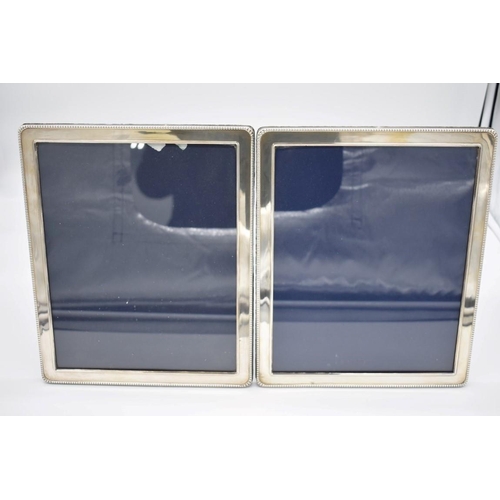 389 - A pair of silver photograph frames, by Mappin & Webb Ltd, Sheffield 1995, aperture 25.5 x 20.5cm... 