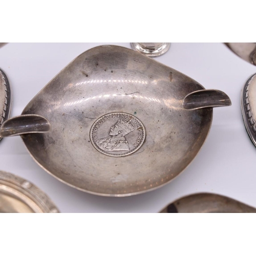 390 - A selection of various silver and silver mounted items, to include, a pair of Celtic bottle holders,... 