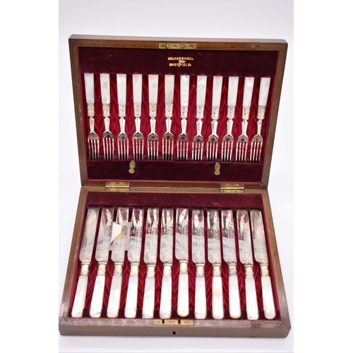 395 - A mahogany cased set of twelve mother of pearl and electroplated fish knives and forks, by Walker an... 