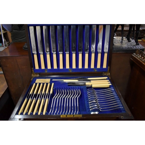 397 - An oak canteen of electroplated Old English pattern cutlery, by Frank Cobb & Co, for twelve, (in... 