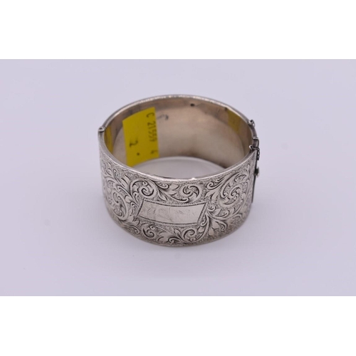 408 - A Victorian chased silver cuff bangle, 51g.