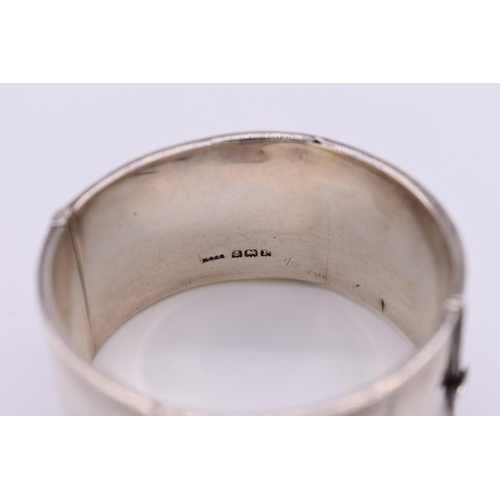 408 - A Victorian chased silver cuff bangle, 51g.