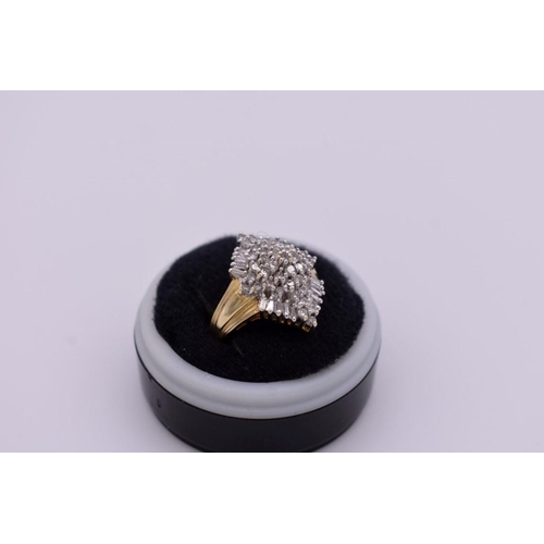 412 - A baguette and brilliant cut diamond cluster gold ring, hallmarked 14ct, 1ct approximately, 6.1g tot... 