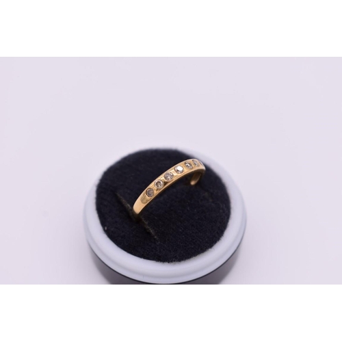 413 - A diamond seven stone half eternity gold ring, hallmarked 9ct, 1.8g total weight.... 