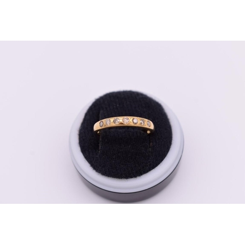 413 - A diamond seven stone half eternity gold ring, hallmarked 9ct, 1.8g total weight.... 