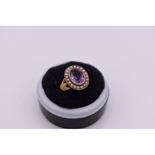 414 - An oval amethyst and pearl unmarked yellow metal ring, 3.4g total weight.