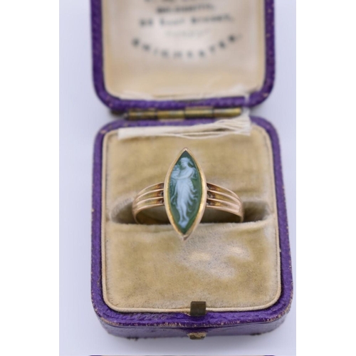 415 - A moss agate carved cameo gold ring, stamped 9ct, 2.3g total weight.