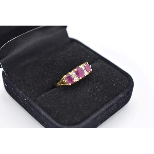 420 - A ruby and diamond gypsy set gold ring, hallmarked 750, 4g total weight.