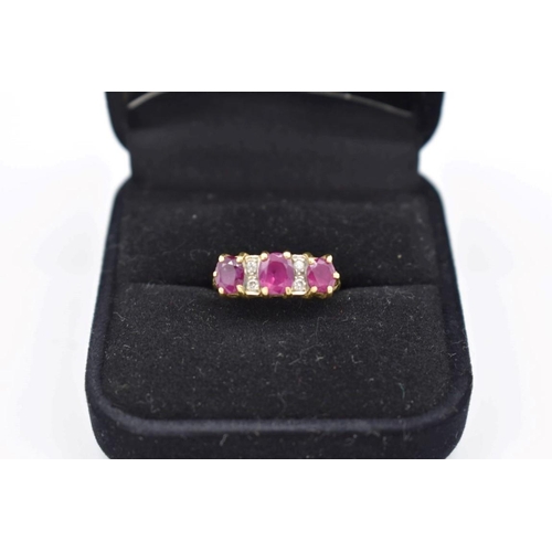 420 - A ruby and diamond gypsy set gold ring, hallmarked 750, 4g total weight.