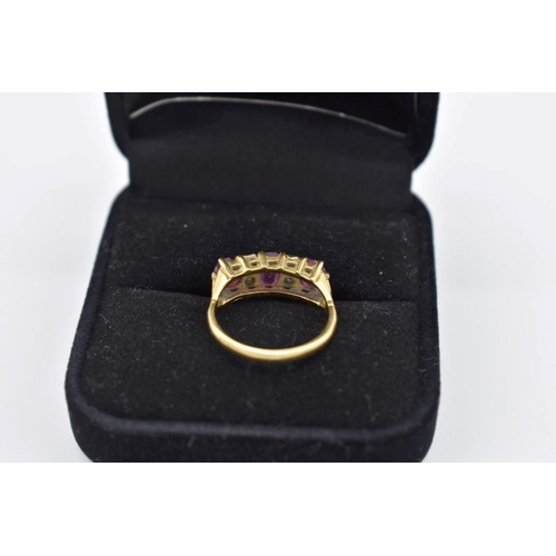 420 - A ruby and diamond gypsy set gold ring, hallmarked 750, 4g total weight.