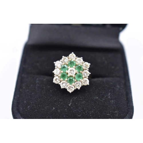 421 - An emerald and diamond cluster gold ring, hallmarked 18ct, 6.5g total weight.