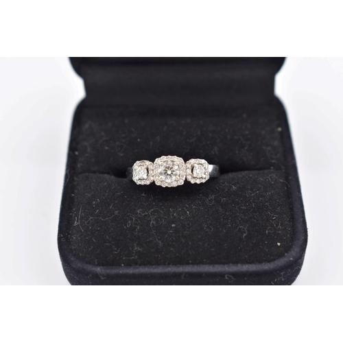 422 - A diamond trilogy white gold ring, hallmarked 750, 6g total weight.