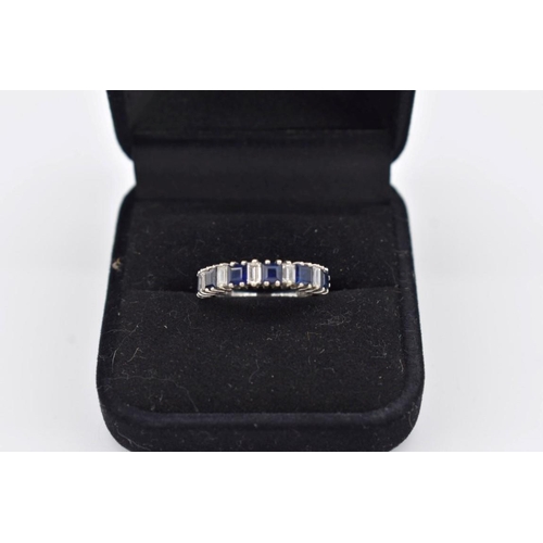 423 - A square cut sapphire and baguette diamond half eternity white gold ring, hallmarked 18ct/750, ... 