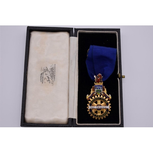 427 - A cased gold and coloured enamel Rotary Club Tottenham Past President neck badge, hallmarked 375, wi... 