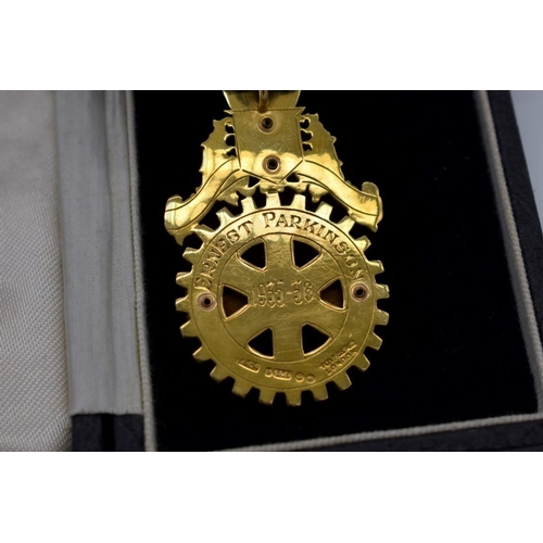 427 - A cased gold and coloured enamel Rotary Club Tottenham Past President neck badge, hallmarked 375, wi... 