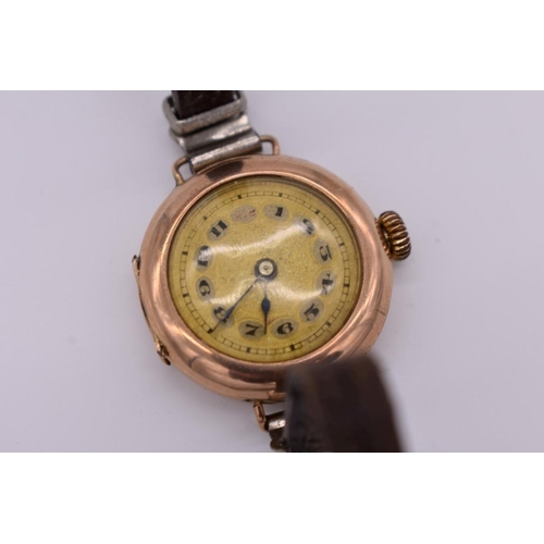 506 - A vintage 9ct gold ladies manual wind wristwatch, on leather strap.