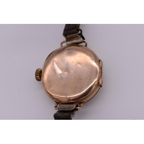 506 - A vintage 9ct gold ladies manual wind wristwatch, on leather strap.