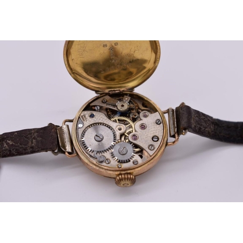 506 - A vintage 9ct gold ladies manual wind wristwatch, on leather strap.