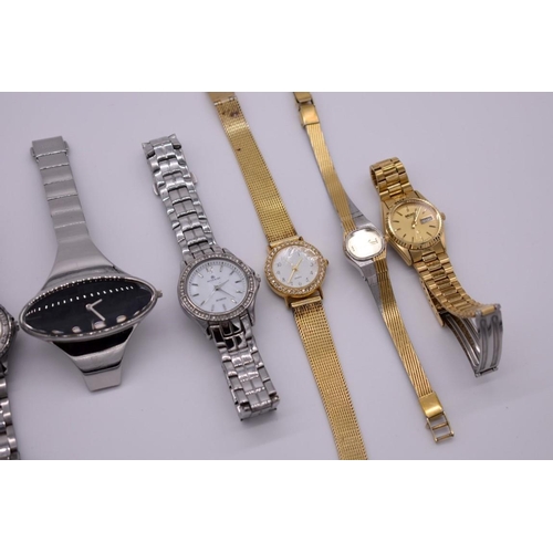 521 - A quantity of modern ladies fashion wristwatches.