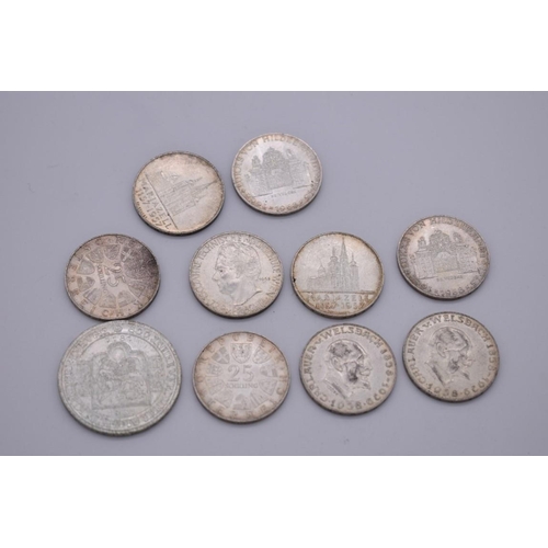 544 - Coins: an Austrian silver 1981 500 Schilling; together with nine Austrian silver 25 Schillings, 141g... 