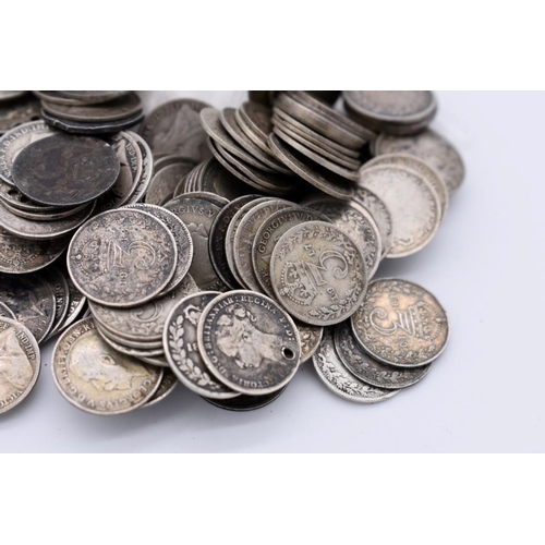 546 - Coins: approximately one hundred and fifty UK silver 3d coins; together with other silver coinage, 2... 