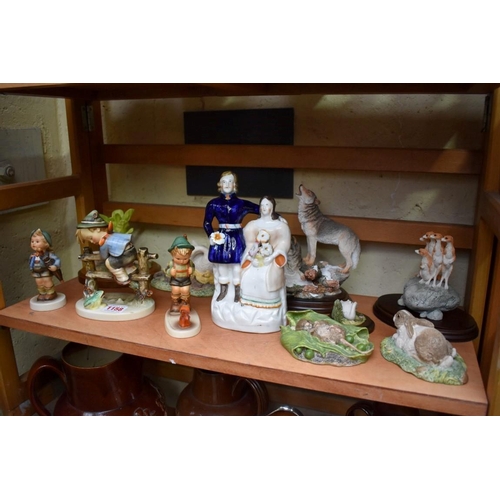 1158 - A Victorian Staffordshire pottery figure group; together with three Hummell figures, (one a.f.); and... 