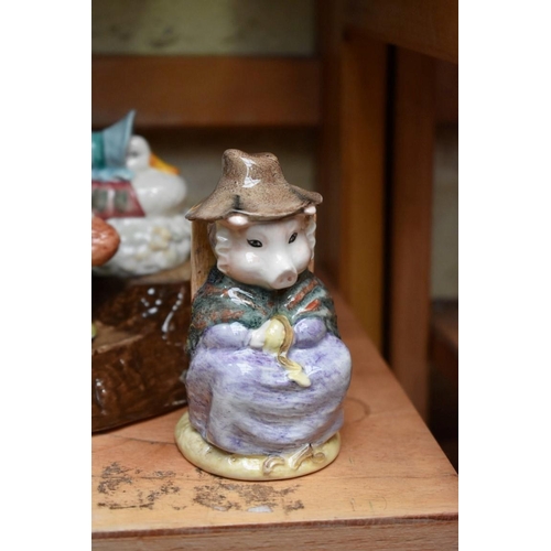 1160 - A collection of seven Royal Albert Beatrix Potter figures, each boxed; together with display st... 