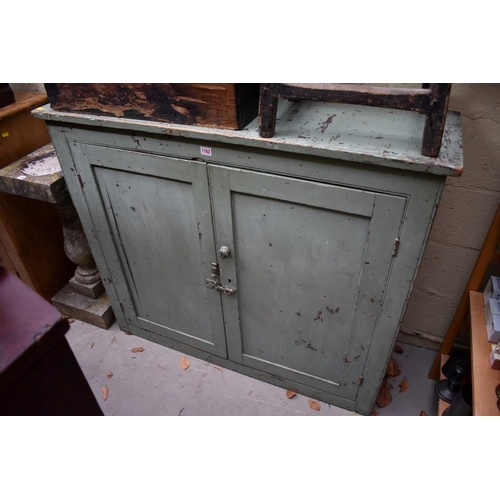 1162 - An antique green painted cabinet, 122cm wide.