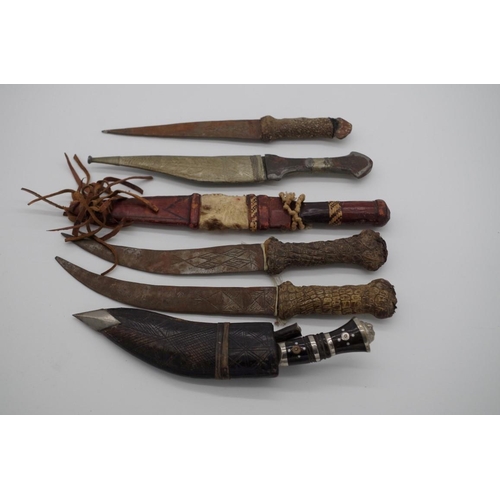 1769 - Four various African knives; together with a small Kukri; and another knife. (6)