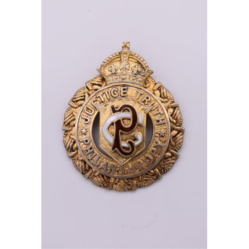 121 - A silver gilt and enamel presentation medallion, by Louis Symelman, London 1912, 23.2g total we... 