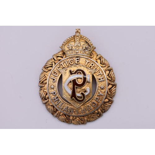 121 - A silver gilt and enamel presentation medallion, by Louis Symelman, London 1912, 23.2g total we... 