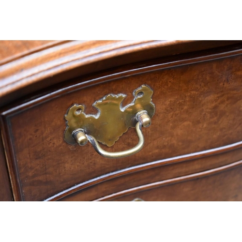 1229 - A small reproduction burr walnut and crossbanded serpentine fronted chest of drawers, 49cm wide... 