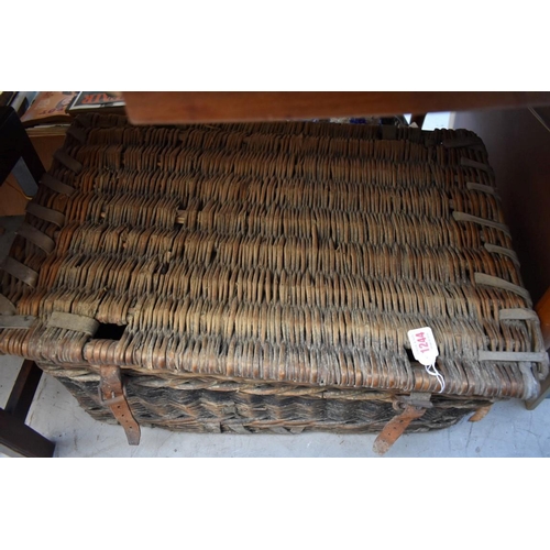 1244 - An old wicker basket, 69cm wide. 