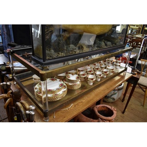 1879 - A brass and glass low rectangular two tier occasional table, 130.5cm wide.  ... 