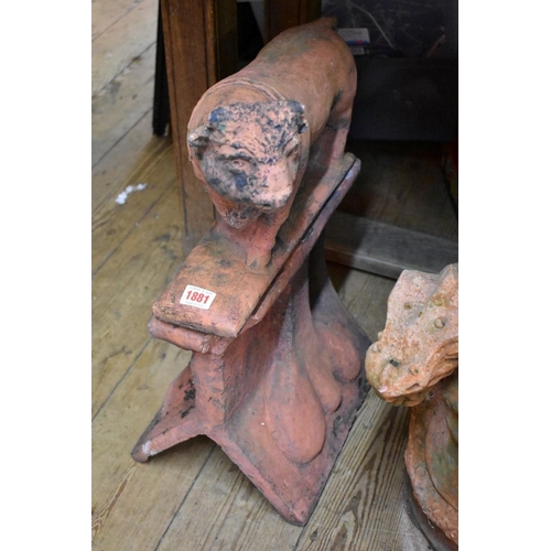 1881 - A red composition stone Bull roof ridge tile, 37.5cm wide.