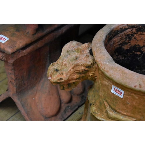 1882 - A red composition stone chimney pot, applied with a dragon, 40cm high.