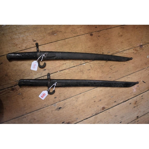 1916 - Two antique Yataghan sword bayonets and sheaths, each having 47cm blades.