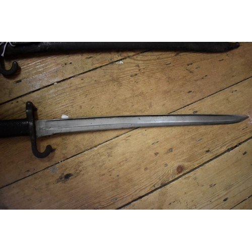 1916 - Two antique Yataghan sword bayonets and sheaths, each having 47cm blades.