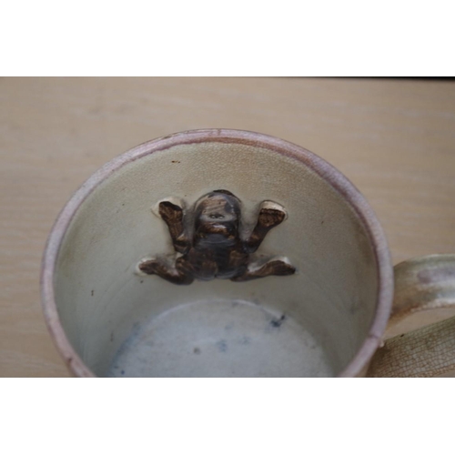 1014 - A group of 19th century and later pottery, to include: a Sunderland lustre frog mug; a Queen Victori... 