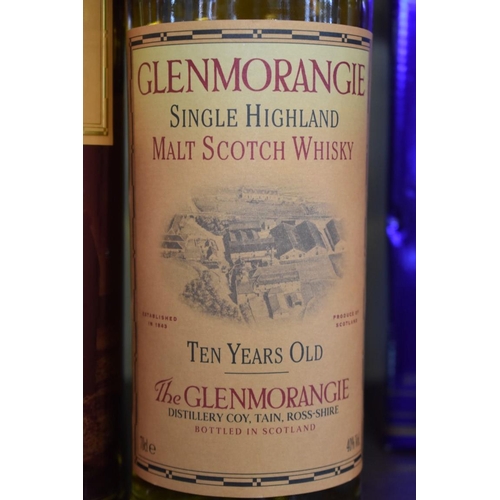 31 - WITHDRAWN FROM SALE: A 70cl bottle of Glenmorangie 10 year old whisky, in metal tube; together with ... 