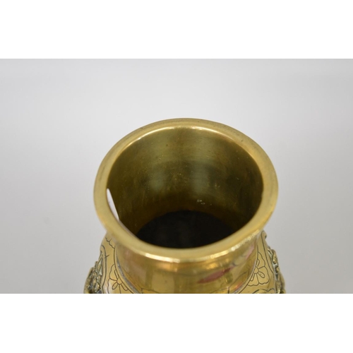 614 - WITHDRAWN FROM SALE: A Chinese polished bronze twin handled tripod vase, with mask handles and panel... 