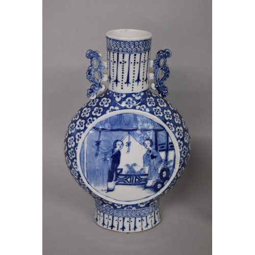 631 - A Chinese blue and white twin handled moon vase, late 19th/early 20th century, painted with panels o... 