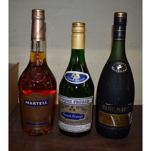 90 - Three bottles of brandy, comprising: Martel VS; Remy Martin VSOP; and Burnez Freres. (3)... 